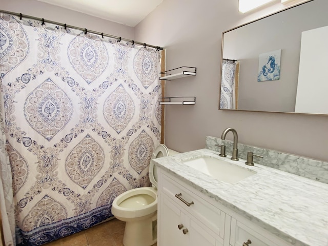 bathroom with tile patterned floors, vanity, toilet, and a shower with curtain