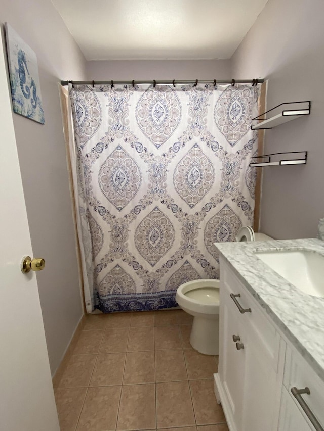 full bathroom featuring tile patterned flooring, vanity, and toilet
