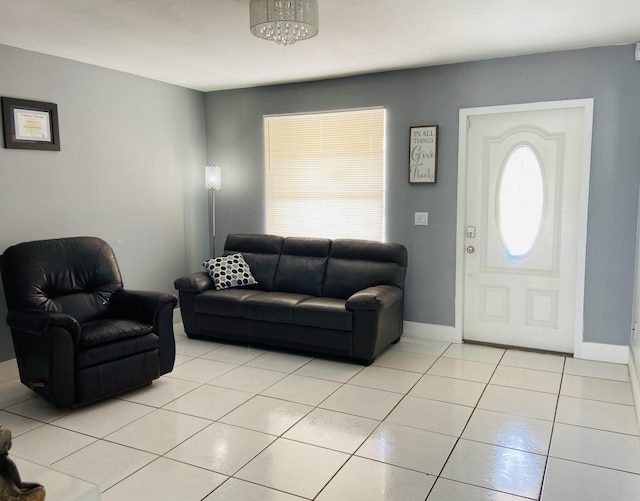 living room with light tile patterned floors and baseboards
