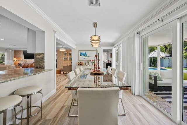 1096 SW 16th St, Boca Raton, FL 33486 - dining room featuring light wood finished floors, crown molding, baseboards, and recessed lighting
