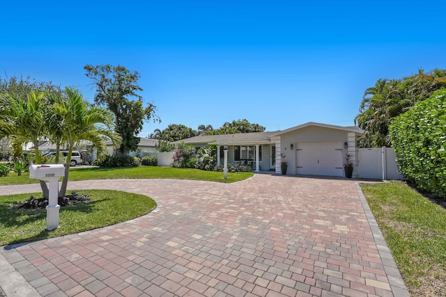 1096 SW 16th St, Boca Raton, FL 33486 - ranch-style house featuring curved driveway, a garage, and stucco siding
