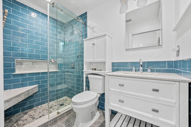 1096 SW 16th St, Boca Raton, FL 33486 - bathroom featuring toilet, tile walls, a shower stall, vanity, and a wainscoted wall
