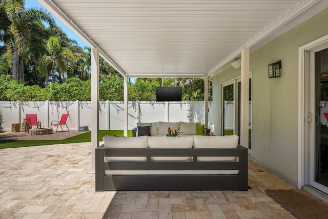 1096 SW 16th St, Boca Raton, FL 33486 - view of patio / terrace with a fenced backyard and an outdoor living space with a fire pit