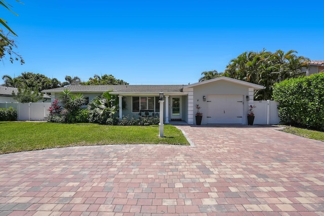 1096 SW 16th St, Boca Raton, FL 33486 - ranch-style house with decorative driveway, a garage, and stucco siding