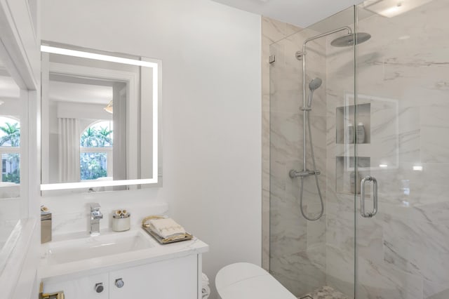 400 S Ocean Blvd Unit R25, Boca Raton, FL 33432 - bathroom featuring vanity, a shower stall, and toilet