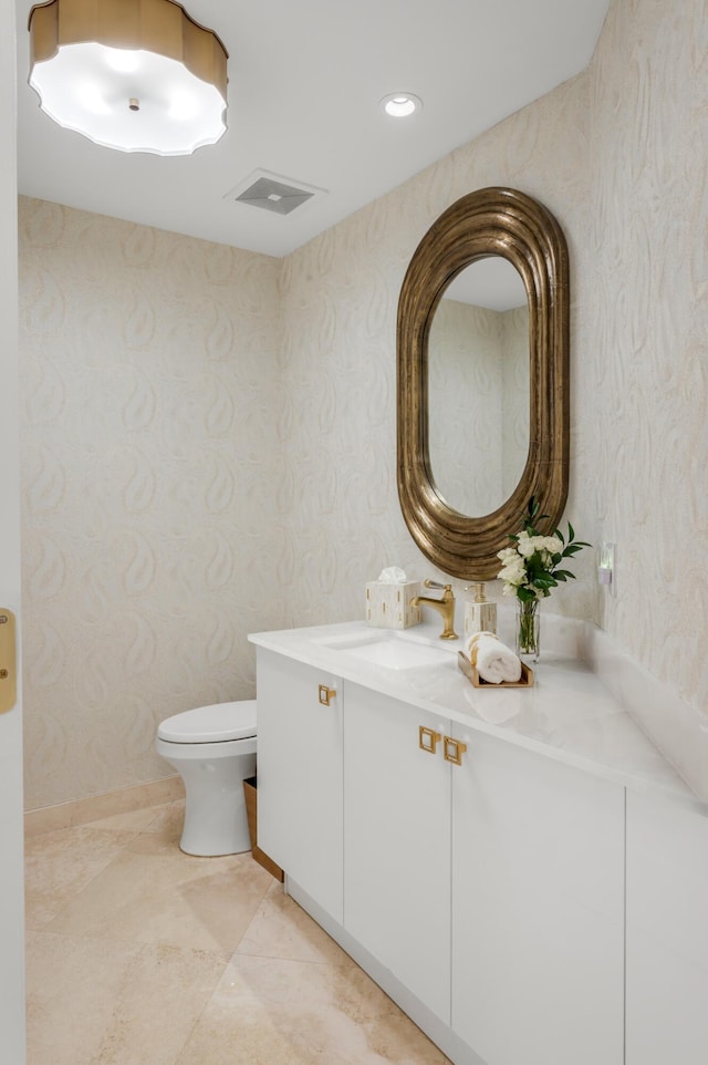 400 S Ocean Blvd Unit R25, Boca Raton, FL 33432 - bathroom featuring wallpapered walls, vanity, and toilet