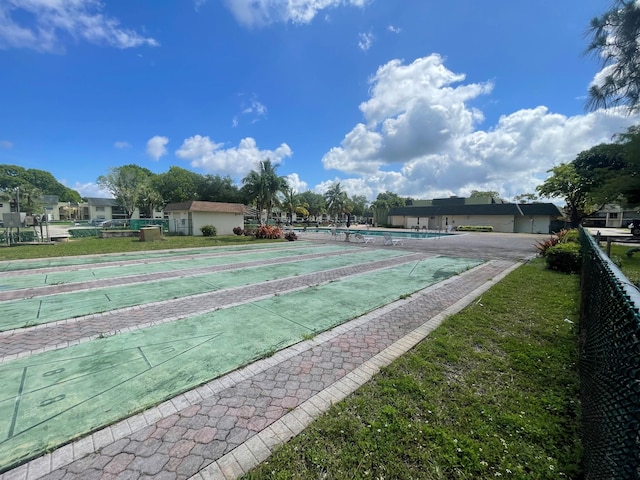 4269 NW 89th Ave Unit 106, Coral Springs, FL 33065 - surrounding community with shuffleboard and fence