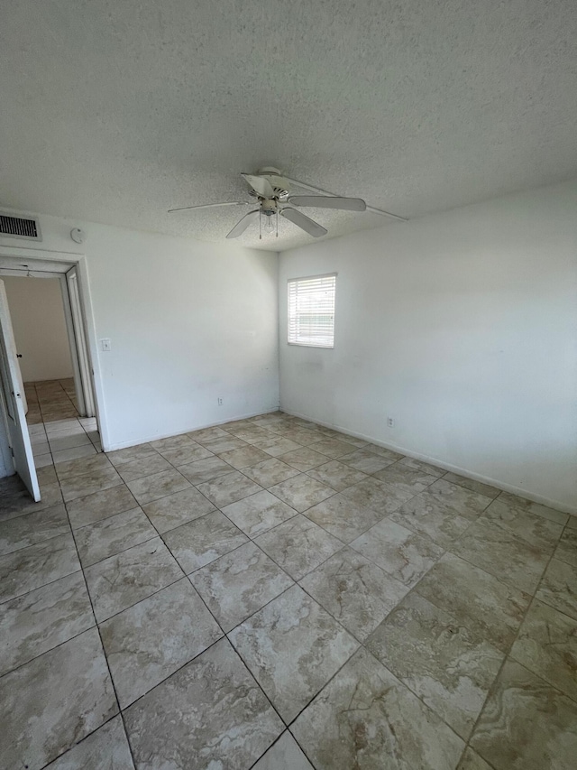 4269 NW 89th Ave Unit 106, Coral Springs, FL 33065 - empty room featuring ceiling fan and a textured ceiling