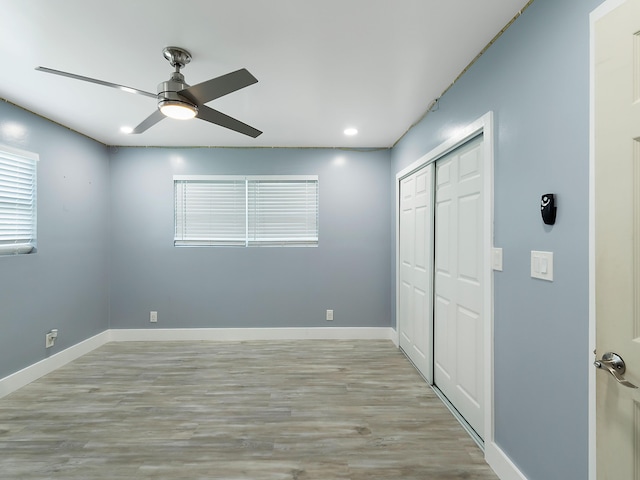1421 E River Dr, Margate, FL 33063 - unfurnished bedroom with a closet, baseboards, wood finished floors, recessed lighting, and ceiling fan