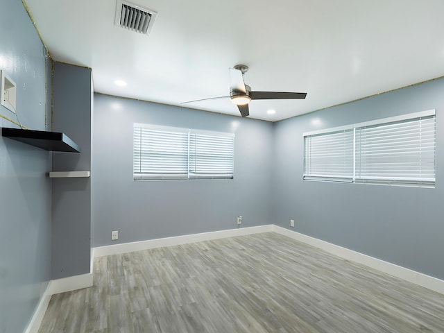 1421 E River Dr, Margate, FL 33063 - unfurnished room with a ceiling fan, wood finished floors, baseboards, and recessed lighting