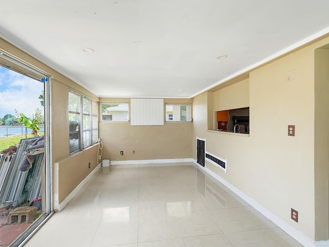 1421 E River Dr, Margate, FL 33063 - unfurnished sunroom featuring baseboards, recessed lighting, and a sink