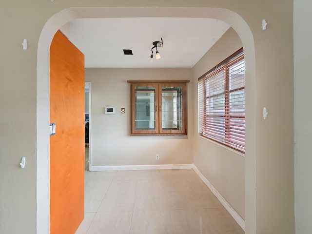 1421 E River Dr, Margate, FL 33063 - hallway featuring arched walkways and baseboards