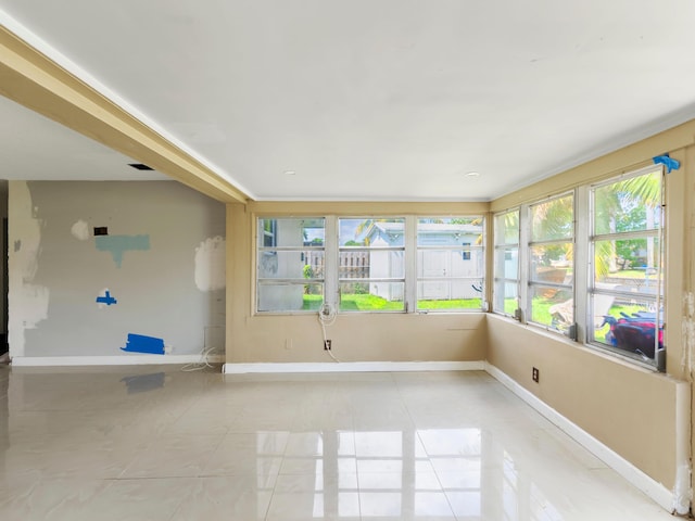 1421 E River Dr, Margate, FL 33063 - unfurnished sunroom featuring baseboards and tile patterned floors