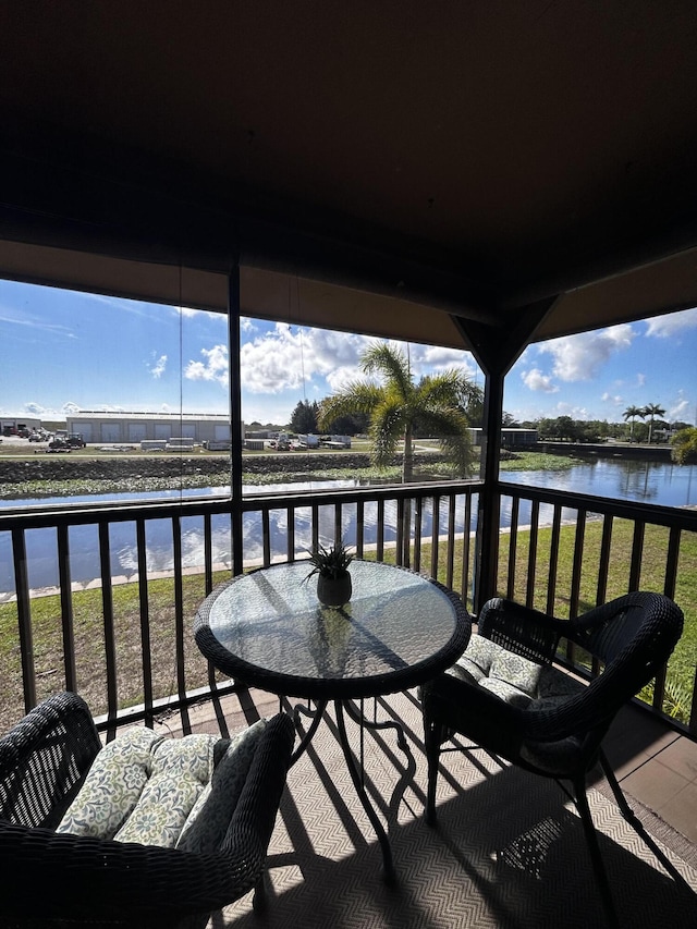500 N Francisco St Unit 211, Clewiston, FL 33440 - balcony featuring a water view