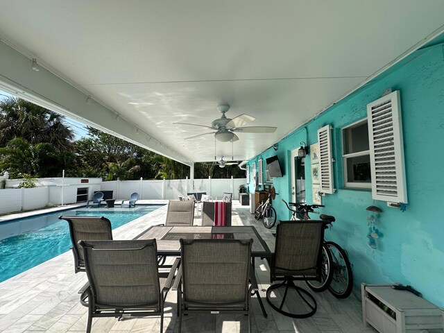 442 Griswold Dr, Lake Worth Beach, FL 33461 - view of patio / terrace featuring a fenced backyard, a ceiling fan, and outdoor dining area