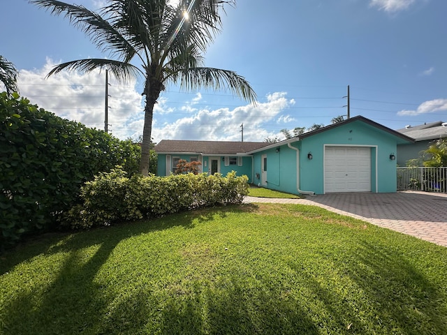 442 Griswold Dr, Lake Worth Beach, FL 33461 - ranch-style house with a garage, decorative driveway, and stucco siding
