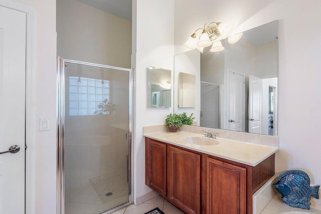 bathroom featuring a stall shower, vanity, and tile patterned flooring