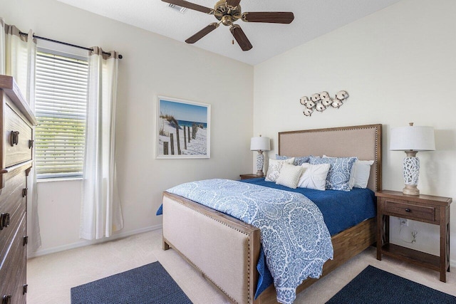 bedroom with carpet floors, a ceiling fan, and baseboards
