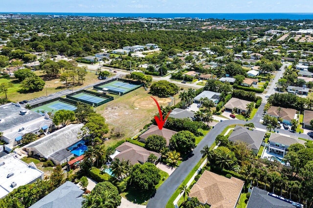 aerial view of property and surrounding area with nearby suburban area