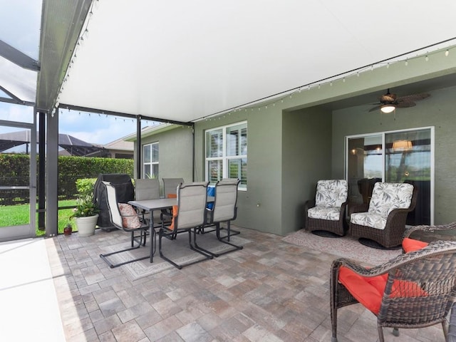 2172 Harwick Cir SW, Vero Beach, FL 32968 - view of patio / terrace featuring a ceiling fan, outdoor dining area, and glass enclosure