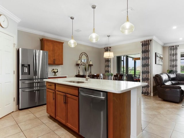 2172 Harwick Cir SW, Vero Beach, FL 32968 - kitchen with appliances with stainless steel finishes, open floor plan, light tile patterned floors, crown molding, and brown cabinets