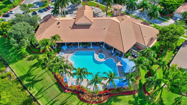 view of subject property with a pool area