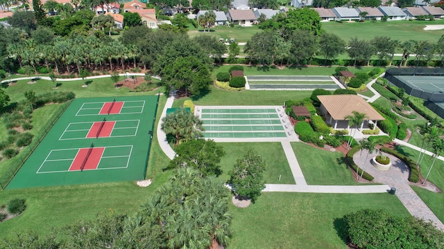 aerial view of property and surrounding area with nearby suburban area