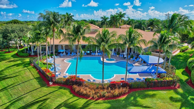 community pool with a patio area