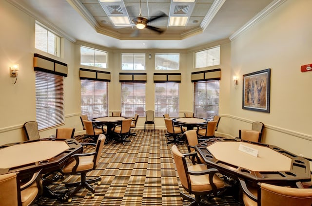 common area featuring crown molding and a high ceiling
