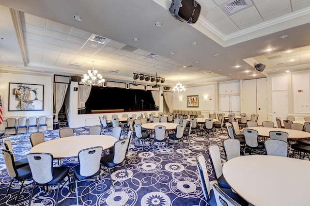 carpeted dining space with ornamental molding, a chandelier, a tray ceiling, and recessed lighting