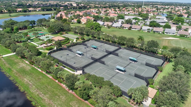 aerial view of property and surrounding area with a nearby body of water
