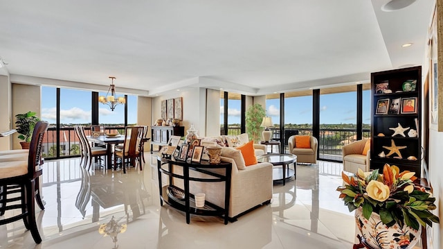4740 S Ocean Blvd Unit 710, Highland Beach, FL 33487 - living area featuring a chandelier, floor to ceiling windows, and light tile patterned floors