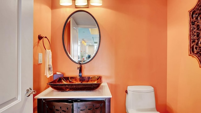 4740 S Ocean Blvd Unit 710, Highland Beach, FL 33487 - half bathroom featuring toilet and vanity