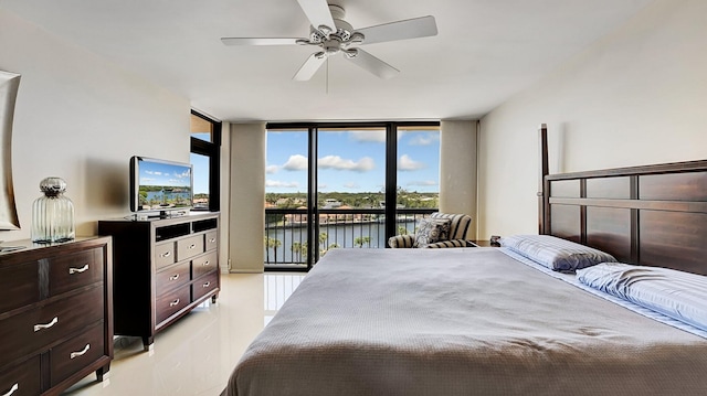 4740 S Ocean Blvd Unit 710, Highland Beach, FL 33487 - bedroom with a wall of windows, access to outside, light tile patterned flooring, and a ceiling fan