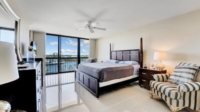 4740 S Ocean Blvd Unit 710, Highland Beach, FL 33487 - bedroom with access to outside, a water view, light tile patterned floors, expansive windows, and a ceiling fan