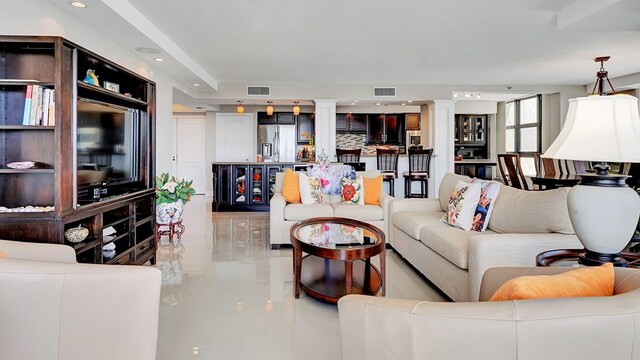 4740 S Ocean Blvd Unit 710, Highland Beach, FL 33487 - living area featuring light tile patterned floors, recessed lighting, and decorative columns