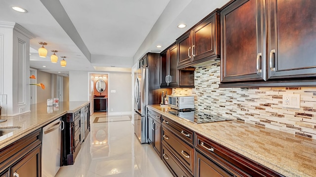 4740 S Ocean Blvd Unit 710, Highland Beach, FL 33487 - kitchen featuring stainless steel appliances, light tile patterned flooring, recessed lighting, light stone counters, and tasteful backsplash