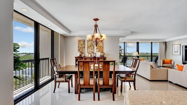 4740 S Ocean Blvd Unit 710, Highland Beach, FL 33487 - dining room featuring a chandelier, a wall of windows, light tile patterned floors, and recessed lighting