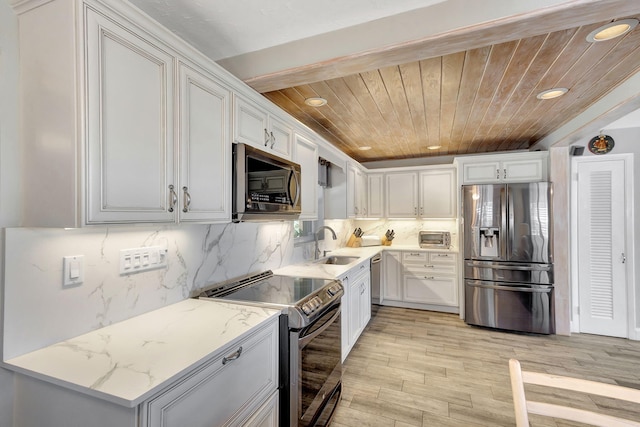 14109 Leeward Way, Palm Beach Gardens, FL 33410 - kitchen featuring appliances with stainless steel finishes, recessed lighting, wooden ceiling, a sink, and white cabinetry