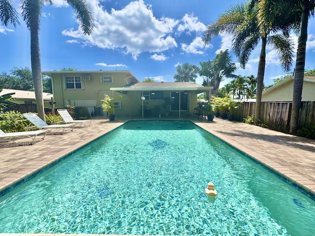 14109 Leeward Way, Palm Beach Gardens, FL 33410 - view of swimming pool featuring a patio and fence