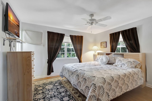 14109 Leeward Way, Palm Beach Gardens, FL 33410 - bedroom with wood finished floors, baseboards, and ceiling fan