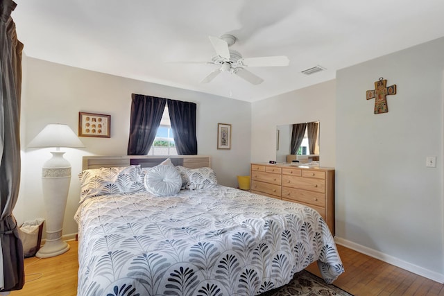 14109 Leeward Way, Palm Beach Gardens, FL 33410 - bedroom featuring light wood-style flooring, baseboards, and a ceiling fan