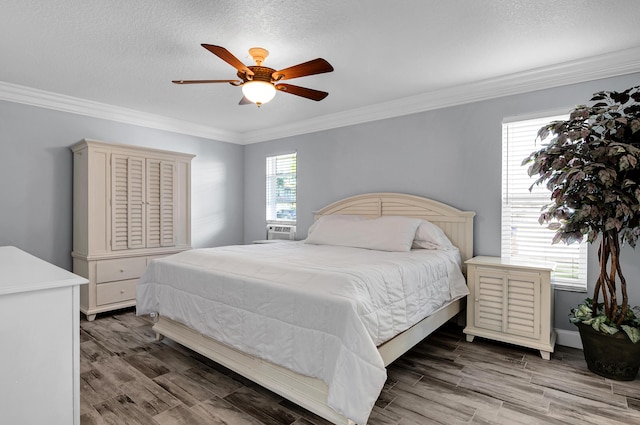 1560 SW 16th St, Boca Raton, FL 33486 - bedroom with ornamental molding, wood finished floors, ceiling fan, and a textured ceiling