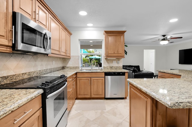1560 SW 16th St, Boca Raton, FL 33486 - kitchen featuring appliances with stainless steel finishes, a sink, ornamental molding, tasteful backsplash, and open floor plan