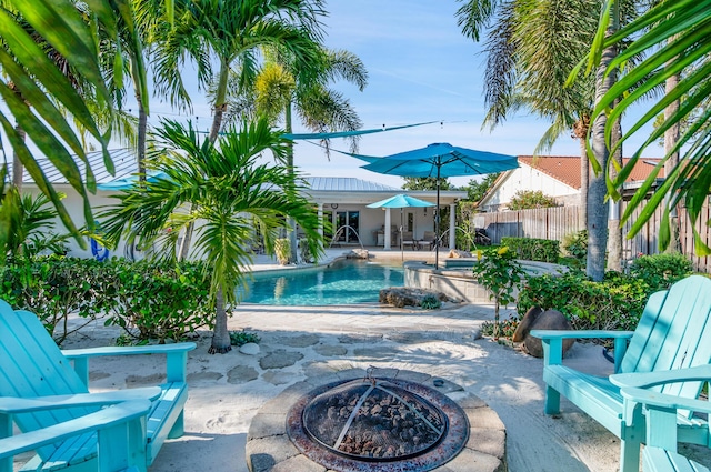 1560 SW 16th St, Boca Raton, FL 33486 - swimming pool featuring a fire pit, a patio area, fence, and a jacuzzi