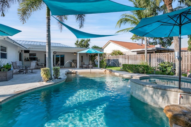1560 SW 16th St, Boca Raton, FL 33486 - view of swimming pool featuring fence, ceiling fan, a patio area, and a pool with connected hot tub