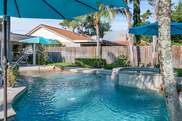 1560 SW 16th St, Boca Raton, FL 33486 - view of swimming pool featuring fence, a pool with connected hot tub, and a patio area