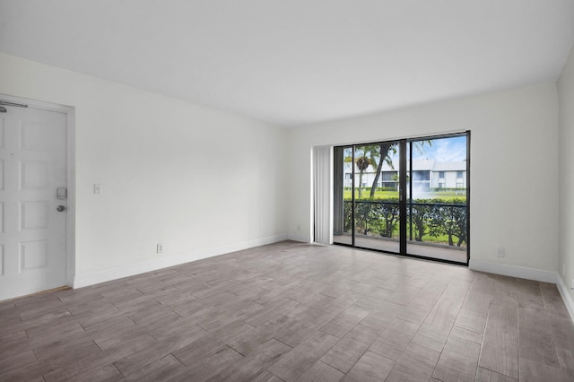 1011 Green Pine Blvd Unit G1, West Palm Beach, FL 33409 - spare room with wood finished floors and baseboards