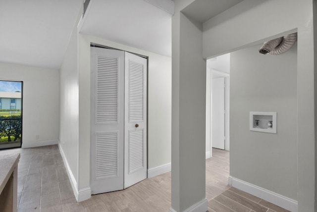 1011 Green Pine Blvd Unit G1, West Palm Beach, FL 33409 - corridor featuring light wood finished floors, baseboards, and lofted ceiling