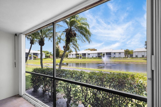 1011 Green Pine Blvd Unit G1, West Palm Beach, FL 33409 - unfurnished sunroom featuring a water view and a residential view